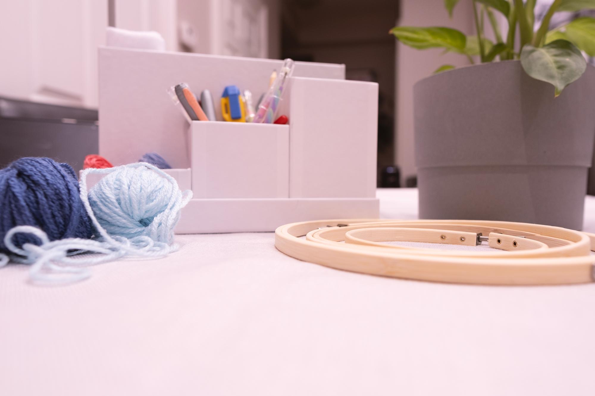 Studio worktable with threads and hoops